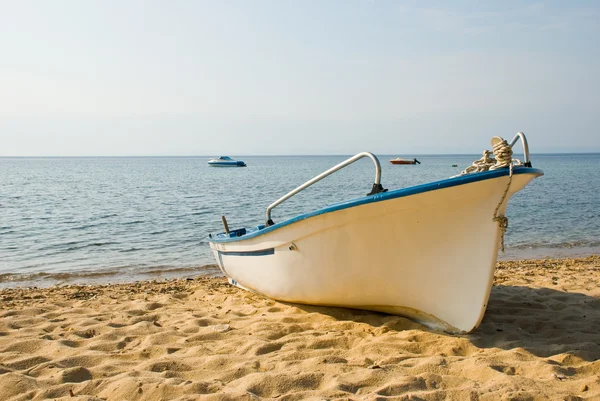 Plastic boat on beach — Stock Photo, Image