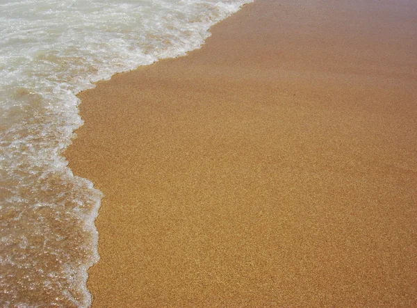 Пісок і морська піна — стокове фото