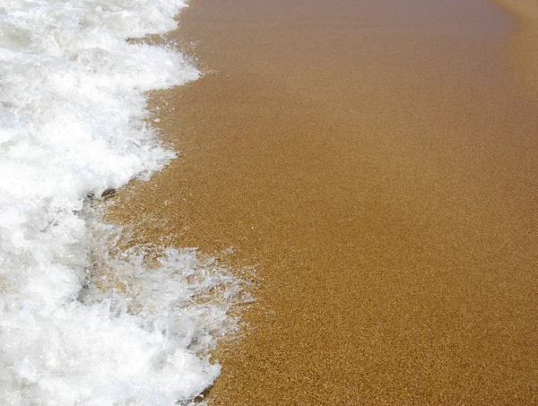 Písek a moře pěna — Stock fotografie