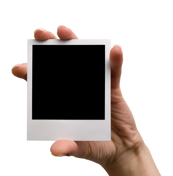 Holding blank polaroid, isolated — Stock Photo, Image