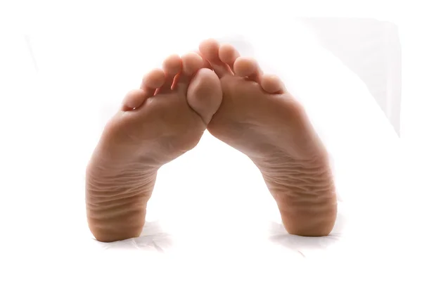 Bellissimi piedi di donna. Isolato su bianco — Foto Stock