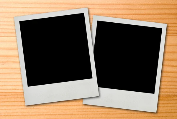 Polaroid frames on wood background — Stock Photo, Image
