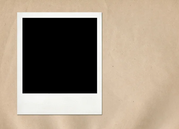 Instant Frame auf altem Papierhintergrund — Stockfoto