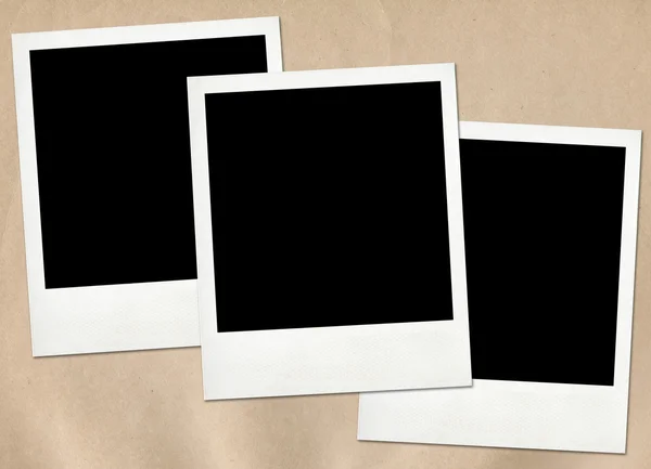 Instant frames on old paper background — Stock Photo, Image