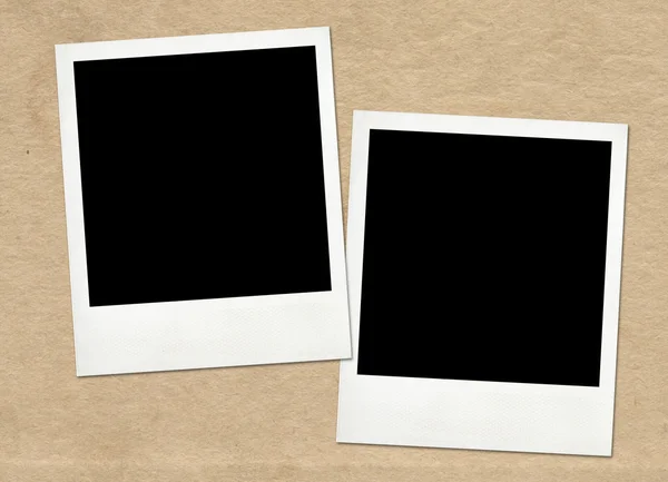 Instant frames on old paper background — Stock Photo, Image