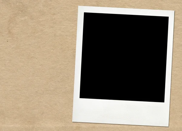 Instant Frame auf altem Papierhintergrund — Stockfoto