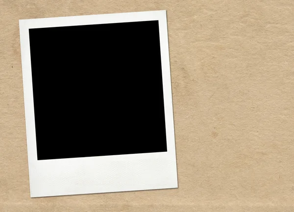 Instant frame on old paper background — Stock Photo, Image