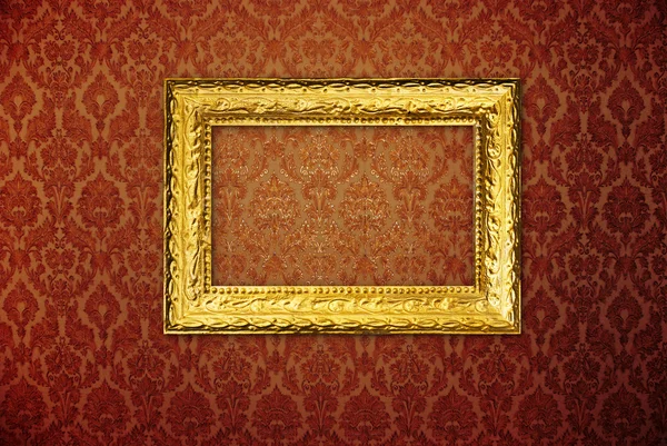Vintage frame over red wallpaper — Stock Photo, Image