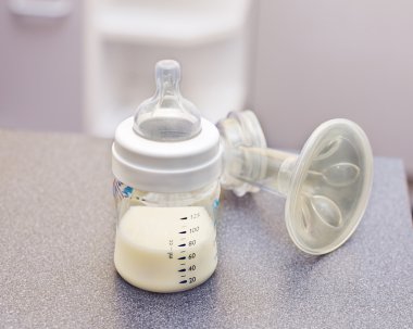 Feeding bottle and breast pump clipart