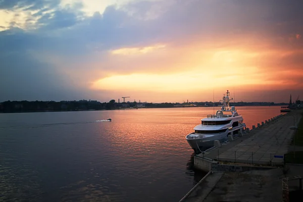 stock image Sunset on the river with yacht