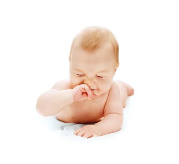 赤ちゃんの鼻をスクラッチ ストック画像