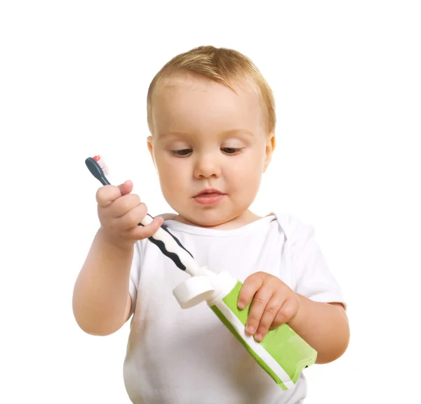 Criança séria com uma escova de dentes — Fotografia de Stock