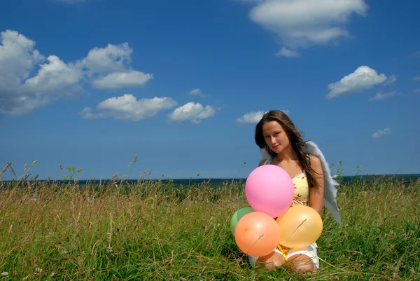 Gelukkige vrouw met ballonnen — Stockfoto