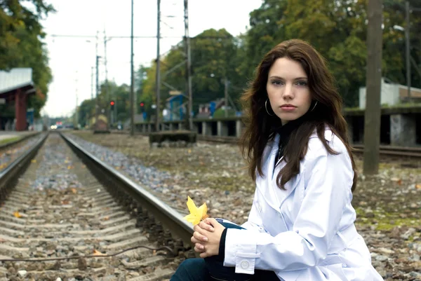 stock image Beautiful woman waiting for the train on