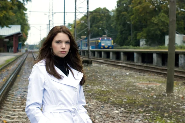 stock image Beautiful woman on railway tracks