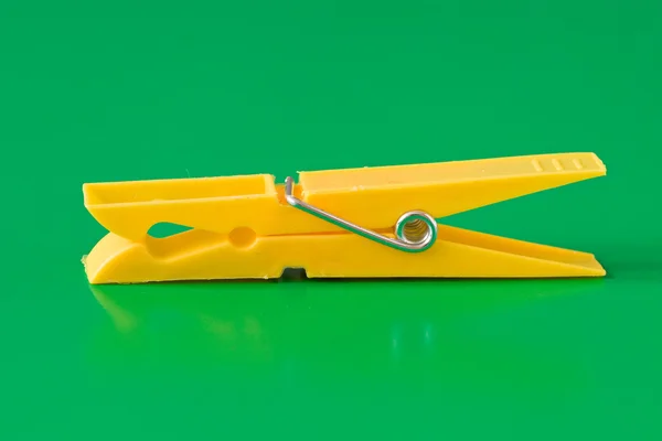 Yellow plastic clothespin — Stock Photo, Image