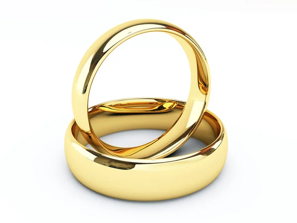 Anillos de boda de oro Imágenes de stock libres de derechos