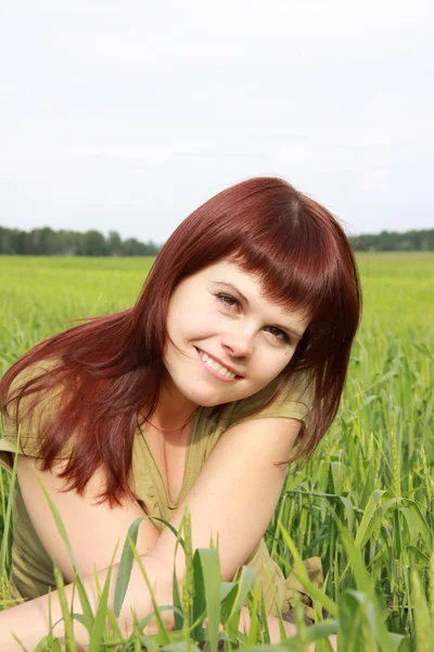 Girl on a green field Royalty Free Stock Images