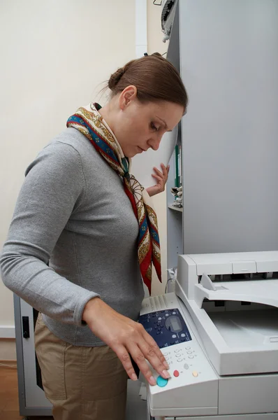 stock image Woman printing a documents. Routine.