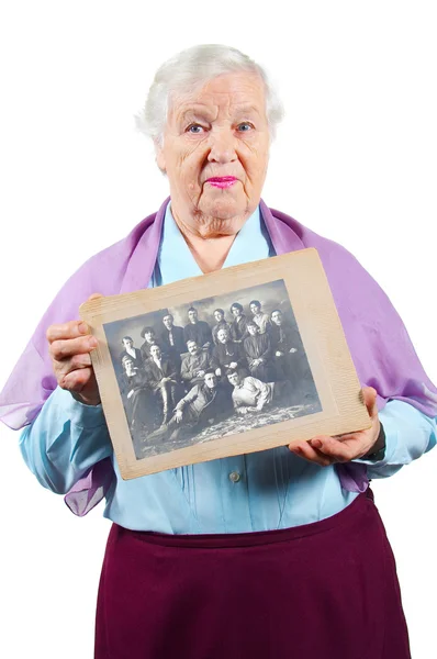 Grandmother with old family photo. Royalty Free Stock Images