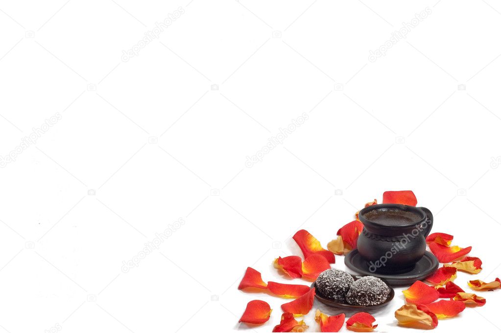 Cup of coffee with petals of roses