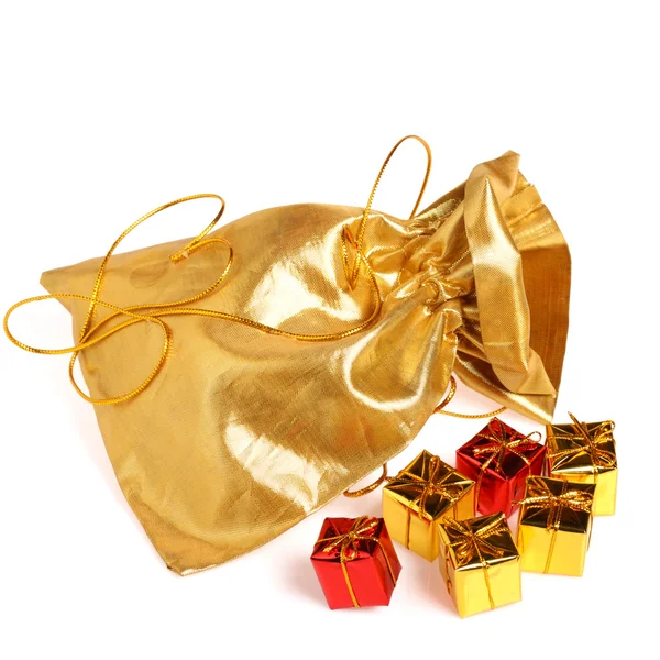 stock image Golden bag with gift boxes