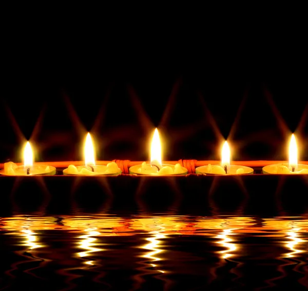 Candles by the water — Stock Photo, Image