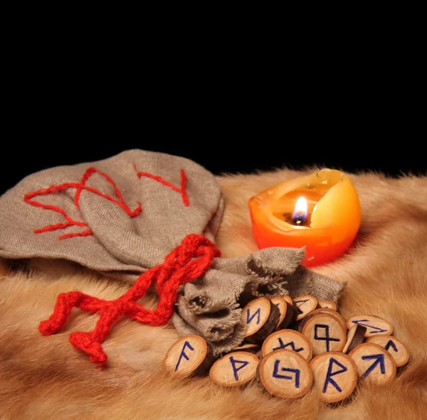 Runes, pouch and candle with copy space — Stock Photo, Image