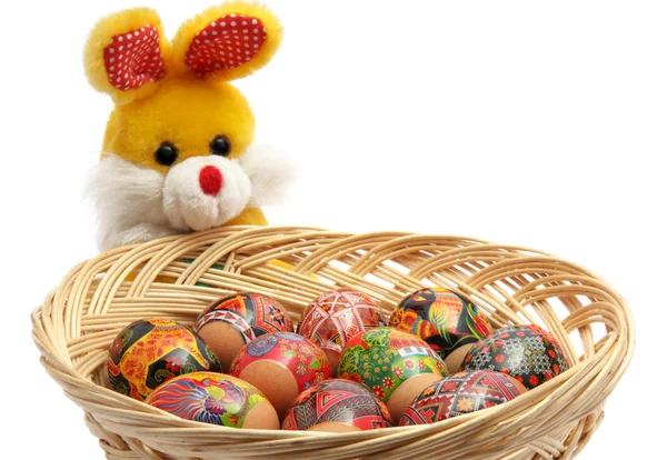 Easter rabbit with basket of easter eggs — Stock Photo, Image