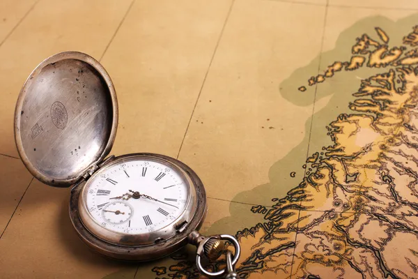 Old silver watch on ancient map — Stock Photo, Image