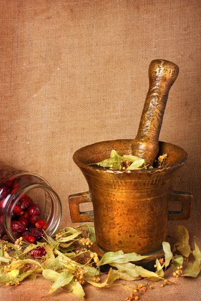 Old bronze mortar with herbs — Stock Photo, Image