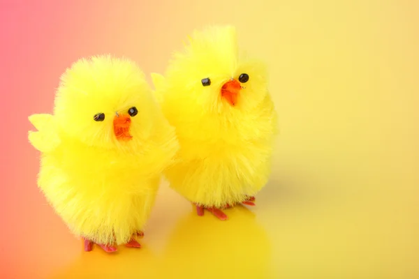 Easter chickens on color background — Stock Photo, Image