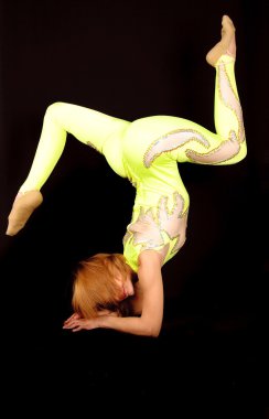 Gymnast in the bright stage costume clipart