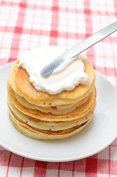 Pancakes with whipped cream — Stock Photo, Image