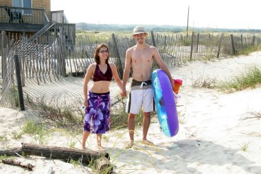 Couple Headed To Beach clipart