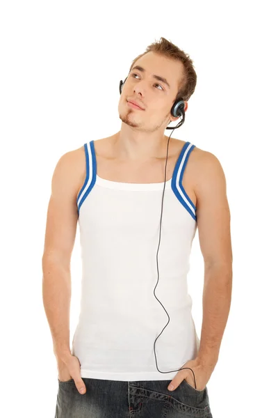 Smiling handsome man is listening music — Stock Photo, Image