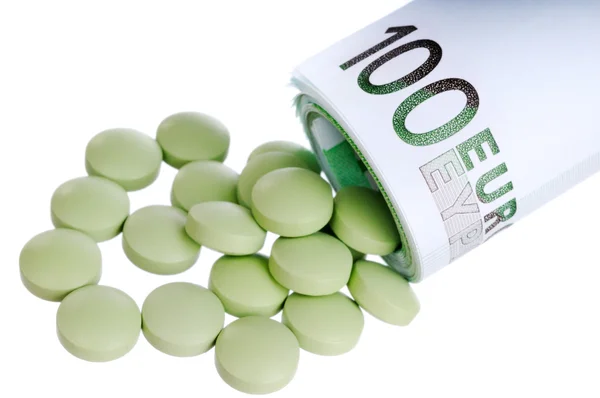 Pills fall out a sheaf of 100 euro — Stock Photo, Image