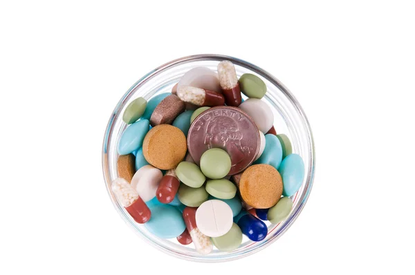 stock image Fifty cents in saucer full of pills