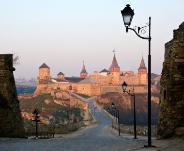 Old castle with towers at dawn clipart