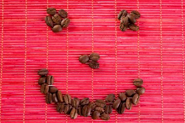 Smile with coffee beans on a mat clipart