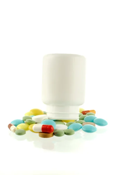 Bottle with falling out pills — Stock Photo, Image