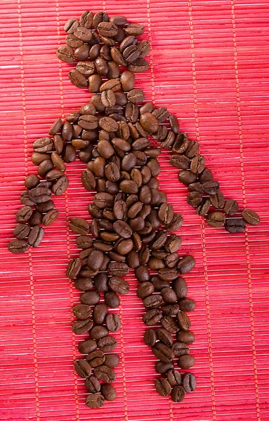Tvar obrázku muž v kávová zrna — Stock fotografie