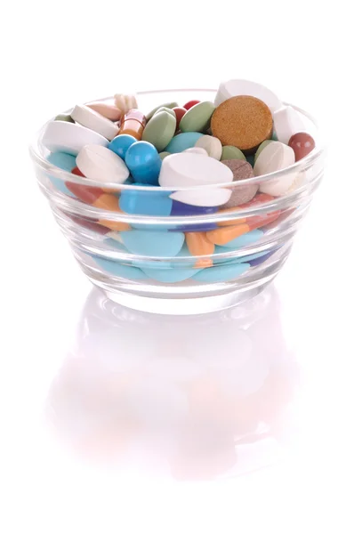 Saucer with many-colored pills — Stock Photo, Image