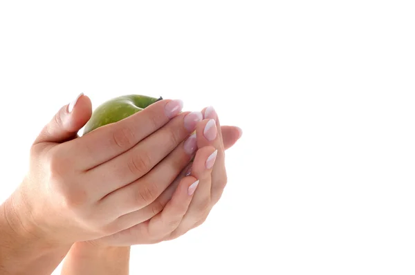 Mãos femininas com manicure e maçã — Fotografia de Stock