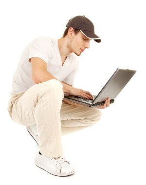 Hansome casual man with open laptop clipart