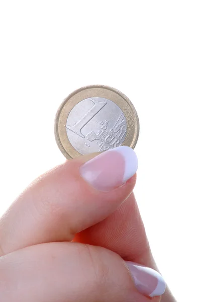 Doigt féminin avec une pièce en euros — Photo