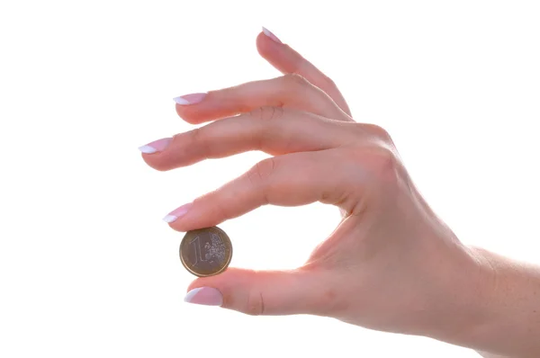 Main féminine avec une pièce d'euro — Photo
