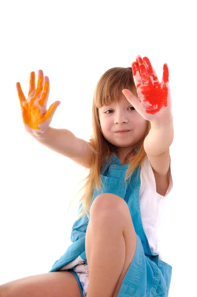 Playful girl with many-coloured hands — Stock Photo, Image