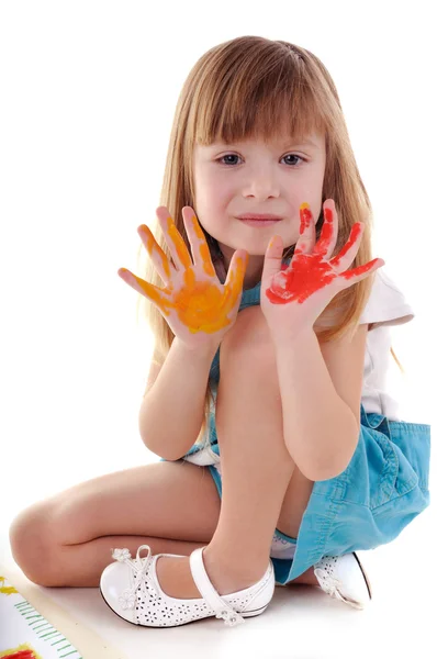 Playful girl with many-coloured hands — Stock Photo, Image