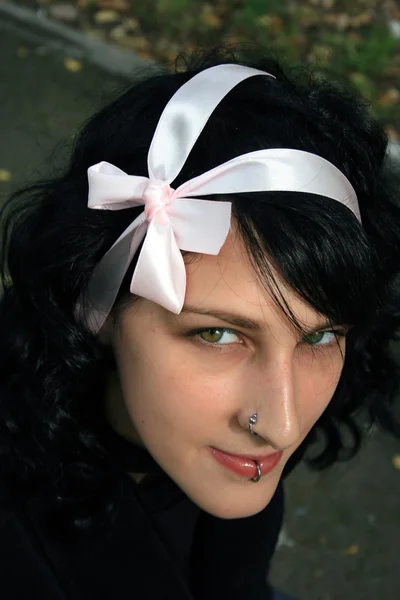 Dark haired girl with bow — Stock Photo, Image